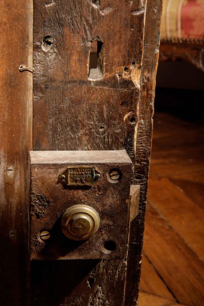 A carved, molded oak oratory surmounted by...