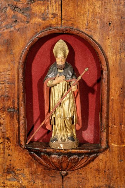 A carved, molded oak oratory surmounted by...