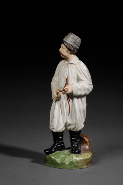 Polychrome porcelain figurine depicting a...