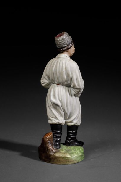 Polychrome porcelain figurine depicting a...