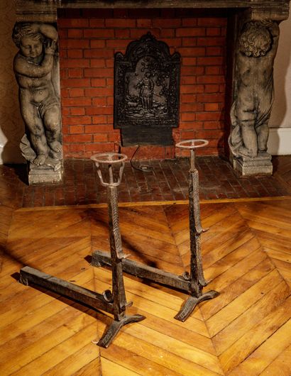 Pair of cast-iron side tables with lightly...