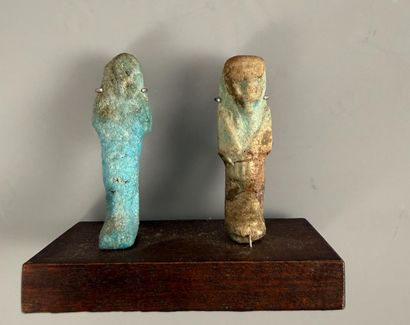 Two uninscribed ushabti figures depicting...