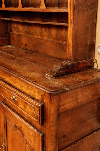 Natural wood sideboard with molded and carved...