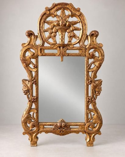 Mirror with wooden glazing beads; the pediment...