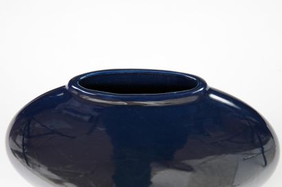Modern round blue earthenware vase with a...