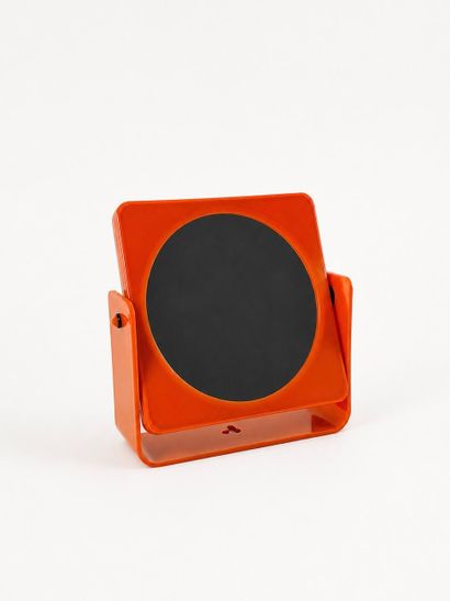 Small double-sided mirror with a magnifying...