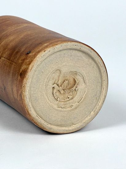 Small, cylindrical vase made of chocolate-brown...