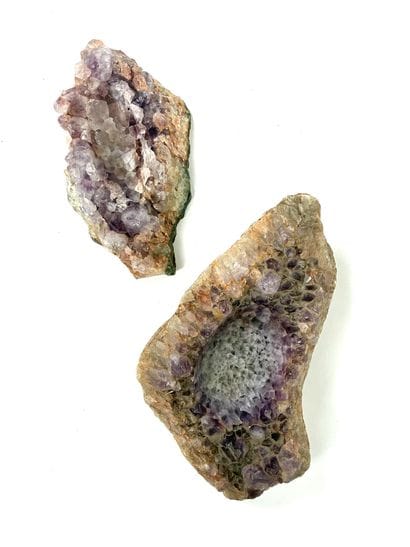 Two ashtrays carved from a block of amethyst...