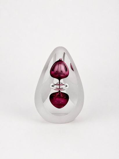 RELLE 
Signed crystal pyramid with pink bubbly...