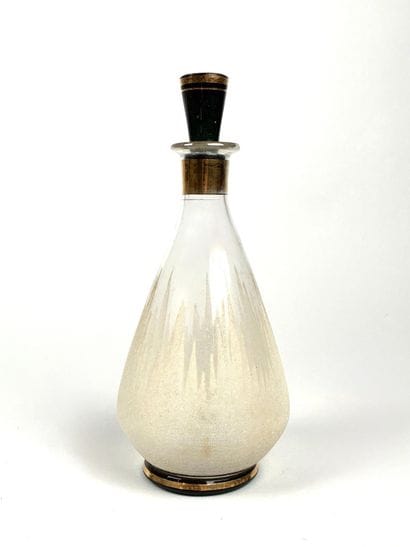 Liqueur bottle made of translucent glass...