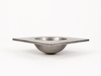 Square-shaped brushed metal tray with a hemispherical...