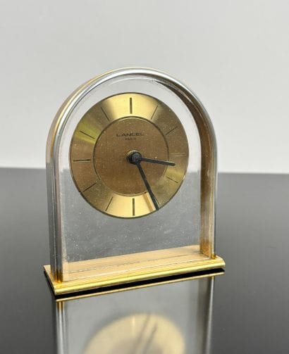 LANCEL Paris
Gilt brass oval-shaped table...
