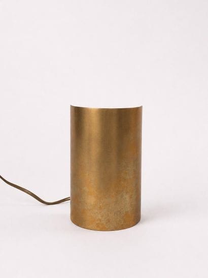 Gold-colored metal table lamp consisting...