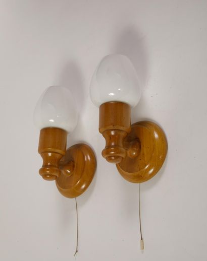 Pair of wall sconces made of turned light...