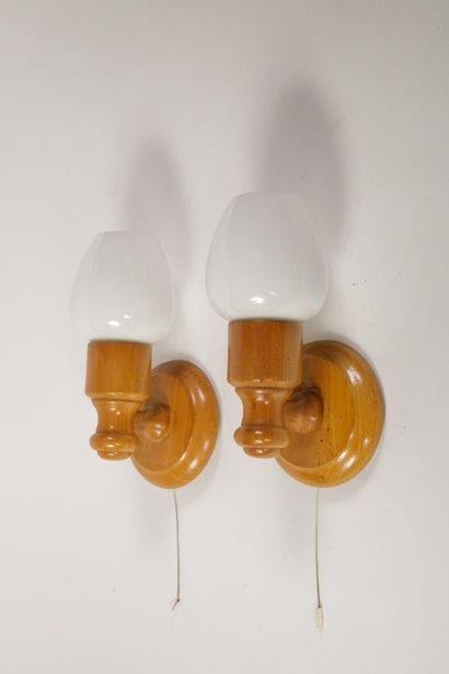 Pair of wall sconces made of turned light...