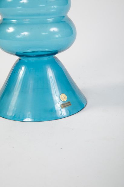 Blue-tinted glass vase with a geometric,...