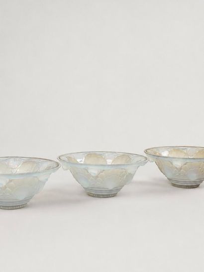 Set of four opalescent pressed-and-molded...
