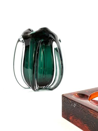 Free-form glass vase in shades of emerald
16...