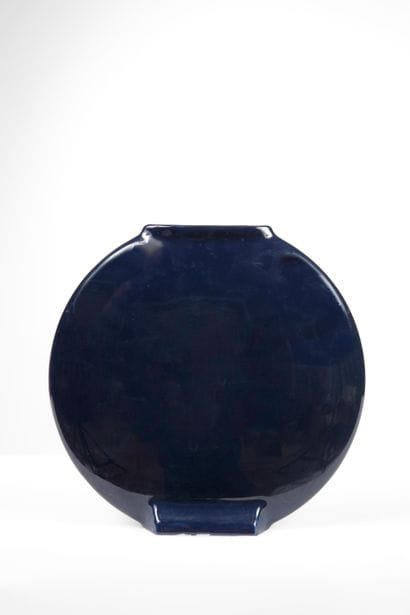 Modern round blue earthenware vase with a...