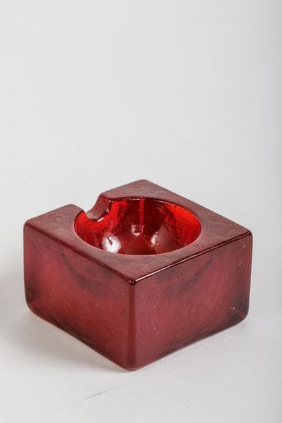 Reddish-brown molded glass square ashtray...