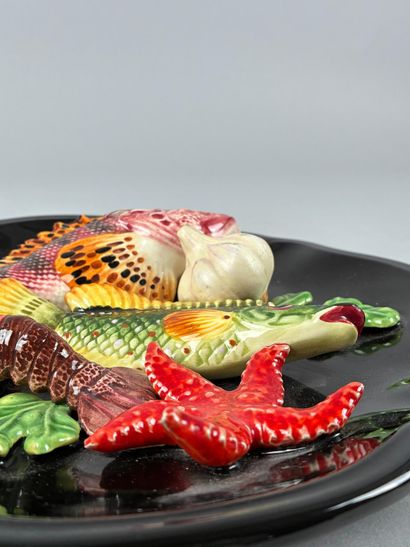 In the style of VALLAURIS,
Polychrome glazed...