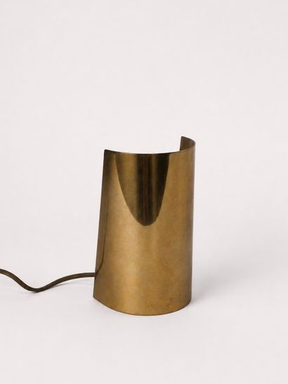 Gold-colored metal table lamp consisting...