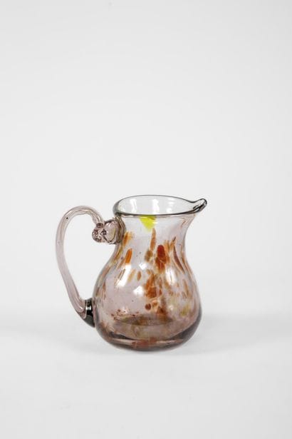 Small multicolored speckled blown glass pitcher...
