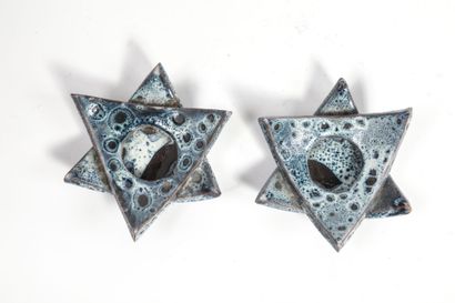 Pair of glazed ceramic candleholders in shades...