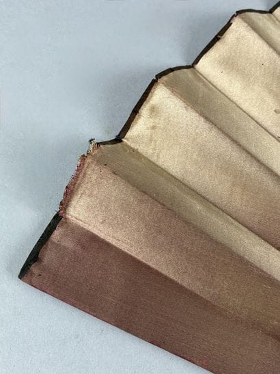 Pink silk fan with a gouache decoration depicting...