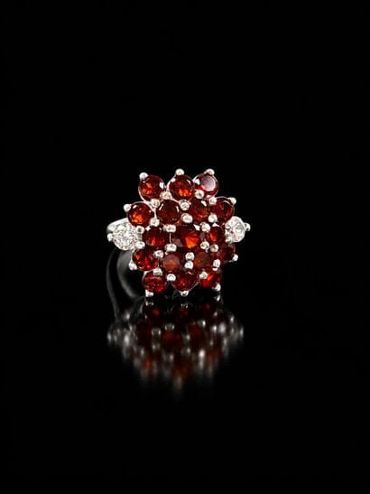 Silver ring featuring a dome-shaped design...
