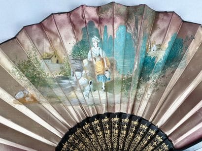 Pink silk fan with a gouache decoration depicting...