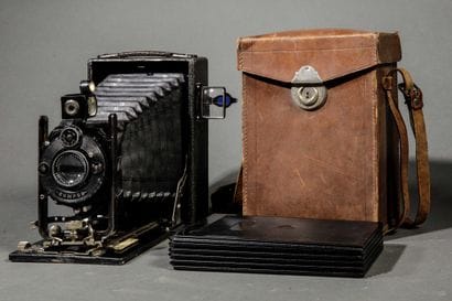 A set of three assorted cameras, including...
