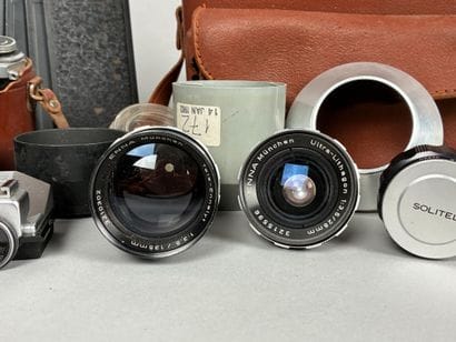 Assorted photography equipment: two cameras...