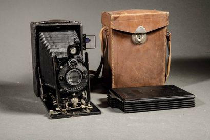 A set of three assorted cameras, including...