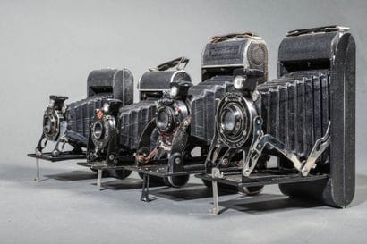 A set of four assorted bellows cameras, including...