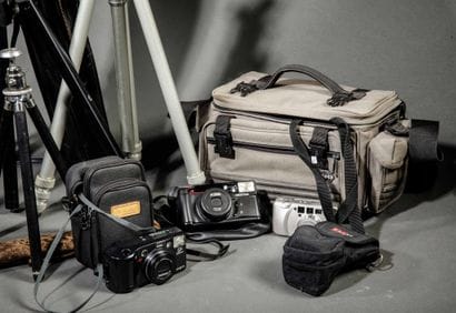Assorted photography equipment. In a bag:...