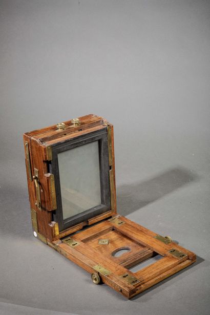 In the suitcase, two wooden view cameras....