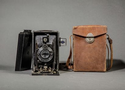 A set of three assorted cameras, including...