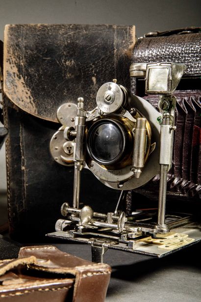 A set of three assorted cameras, including...