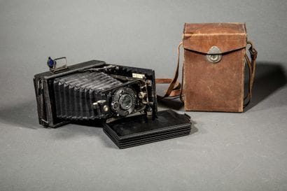 A set of three assorted cameras, including...