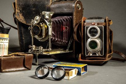 A set of three assorted cameras, including...
