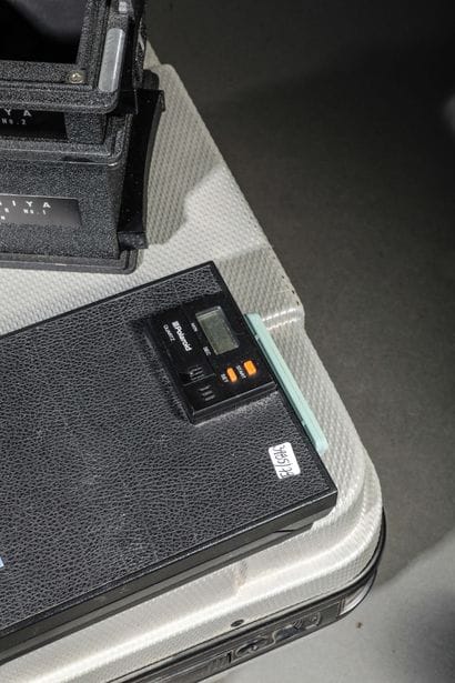 In the case: a Polaroid 600 SE camera with...