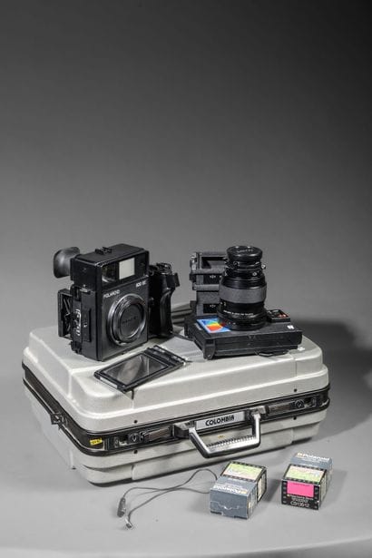 In the case: a Polaroid 600 SE camera with...