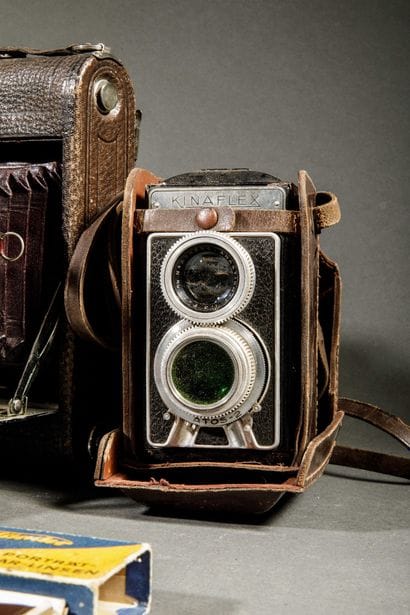 A set of three assorted cameras, including...