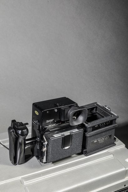 In the case: a Polaroid 600 SE camera with...