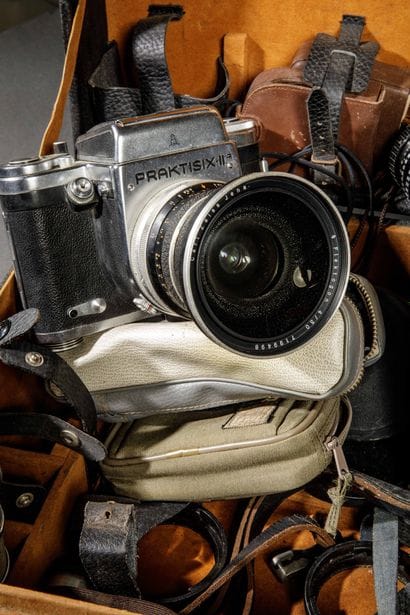 In a suitcase, a set of photographic equipment....