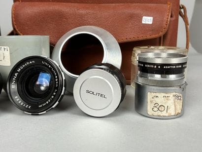 Assorted photography equipment: two cameras...