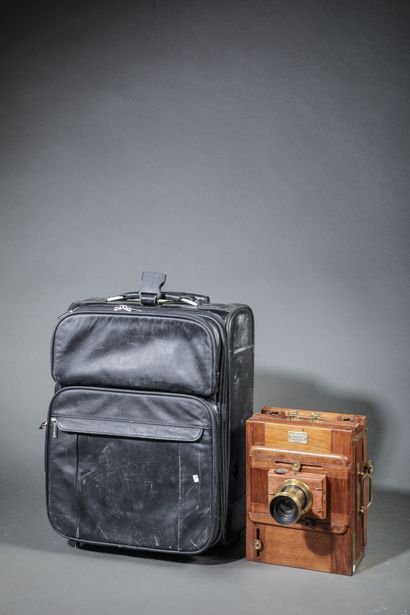 In the suitcase, two wooden view cameras....