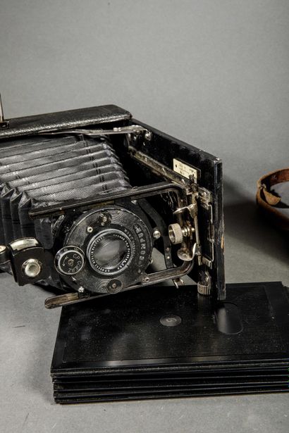 A set of three assorted cameras, including...