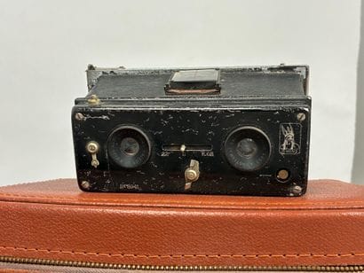 Assorted photography equipment: two cameras...